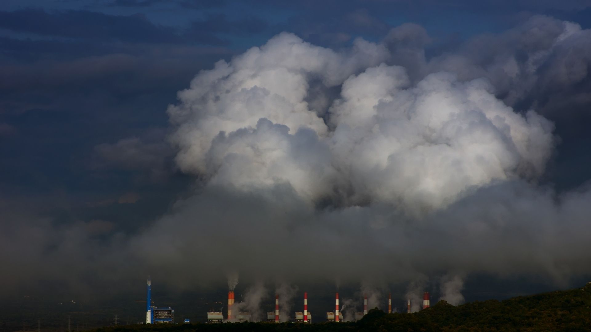 Decorative Image with Power Plant chimneys generating a lot of smoke and fumes